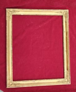 Cornice in legno dorato con motivi decorativi negli angoli Impero I°XIX° sec. luce cm.50x64 est.62x75